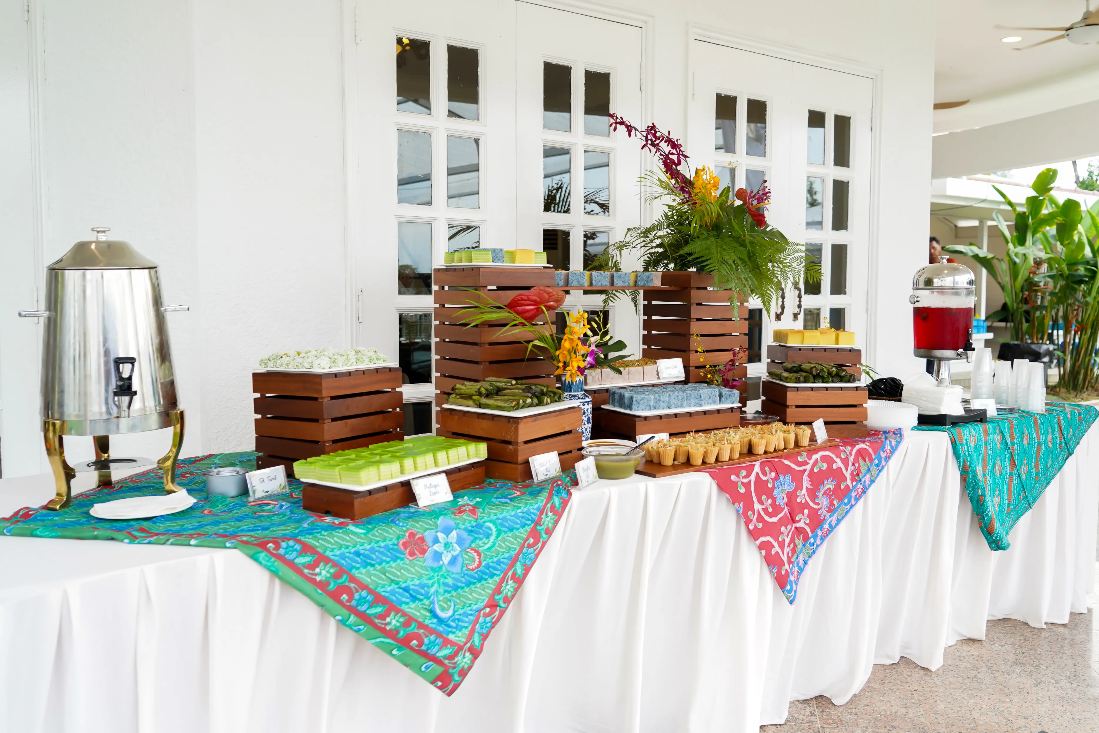 Festive kuih and dessert spread styled for an office celebration